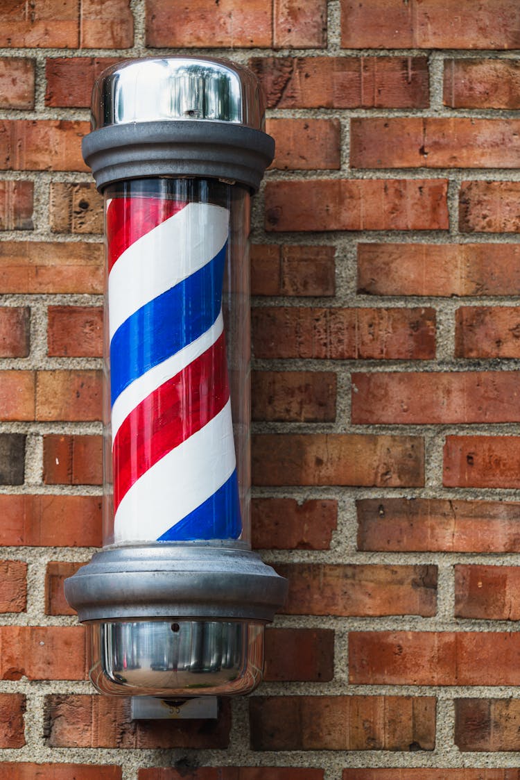 Red Brick Wall With Barbershop Sign