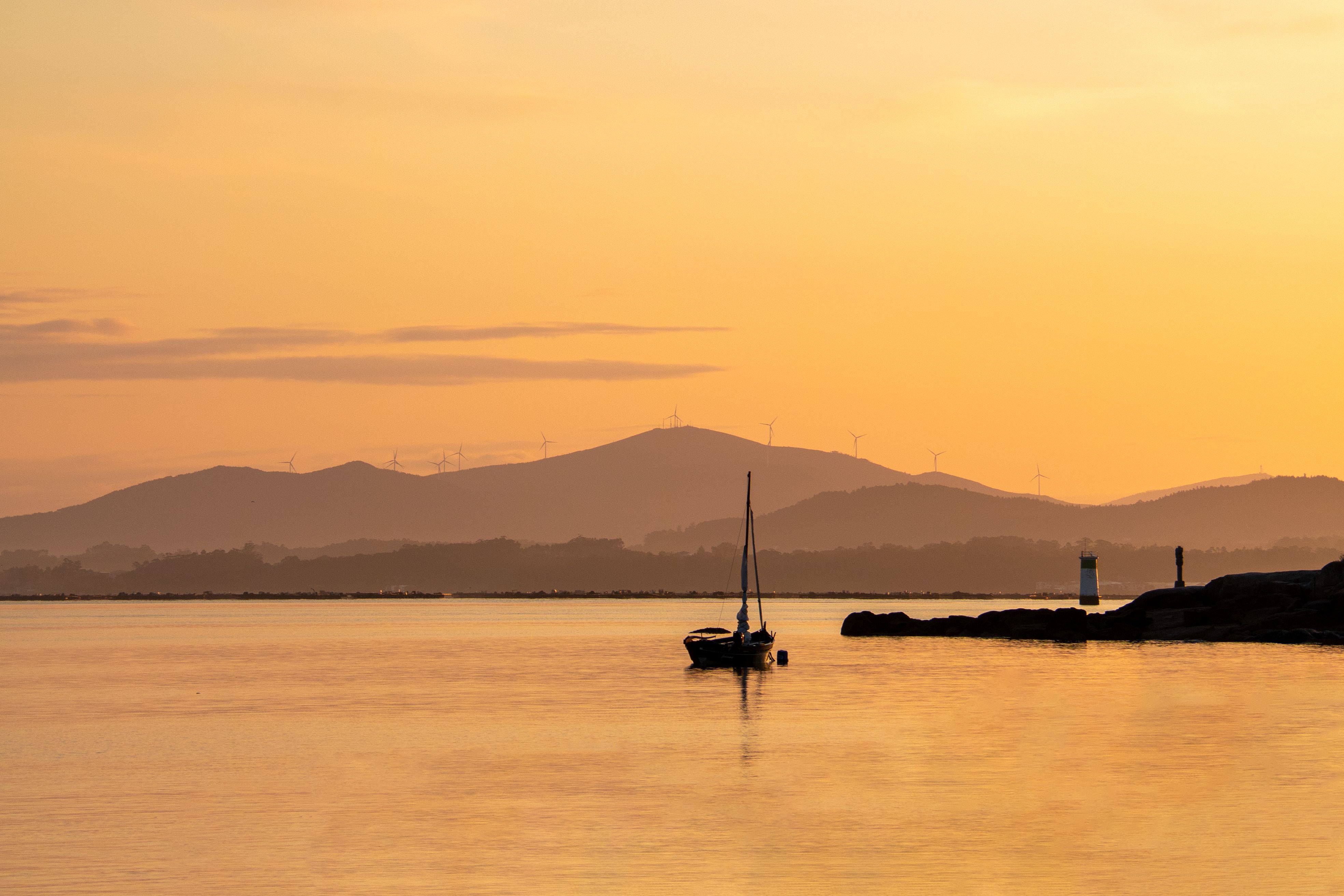 Silhouette of Boat on Body of Water · Free Stock Photo
