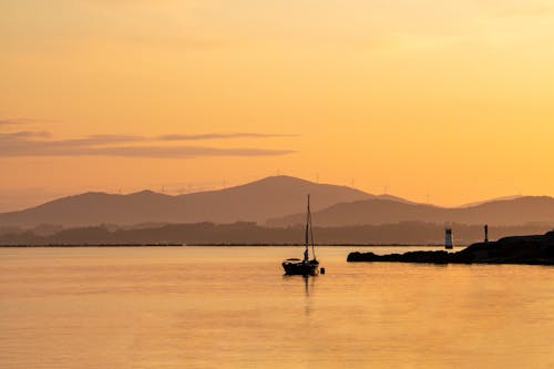 Gratis stockfoto met boot, dageraad, gebied met water