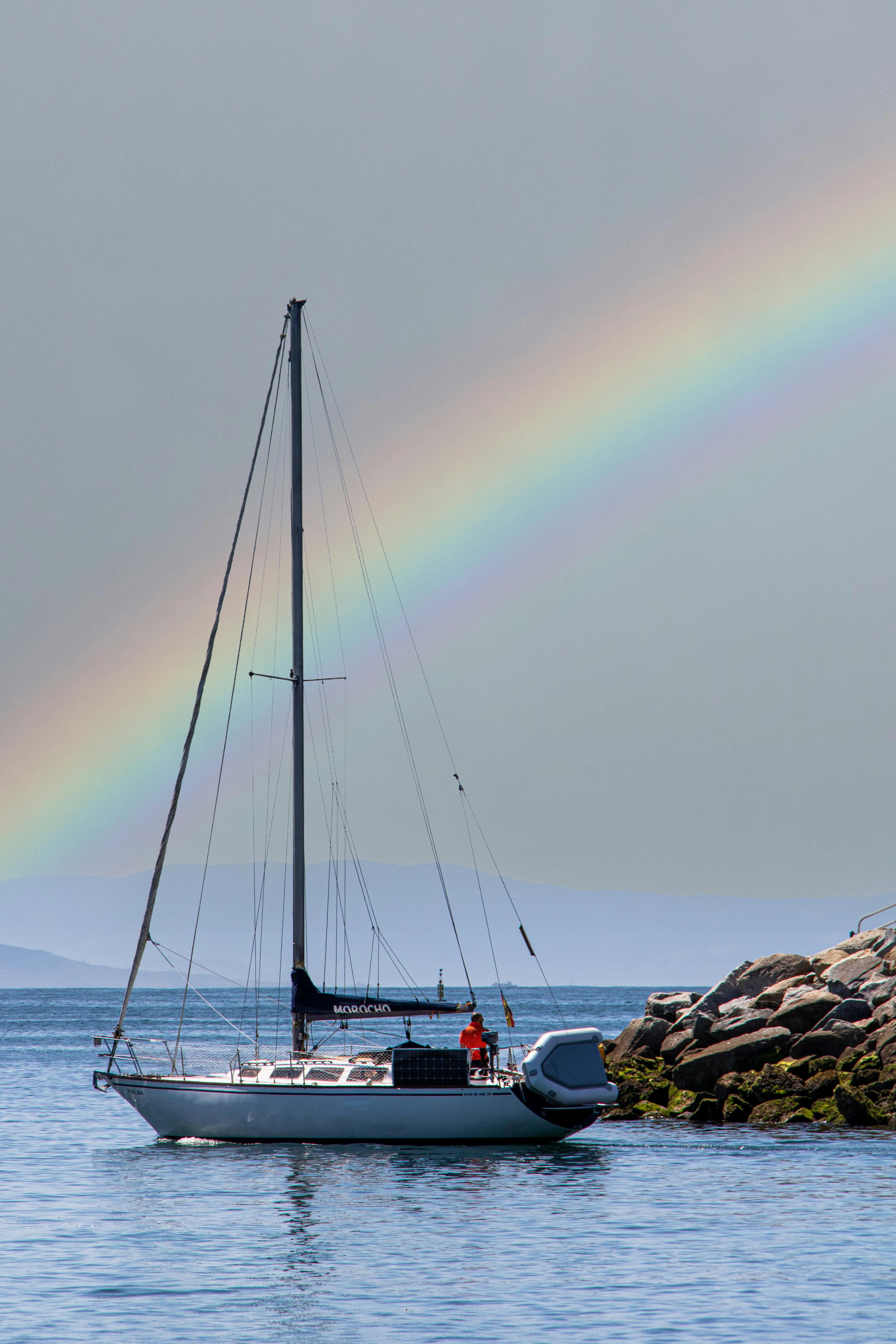 Photograph of an Orange and White Sailboat · Free Stock Photo