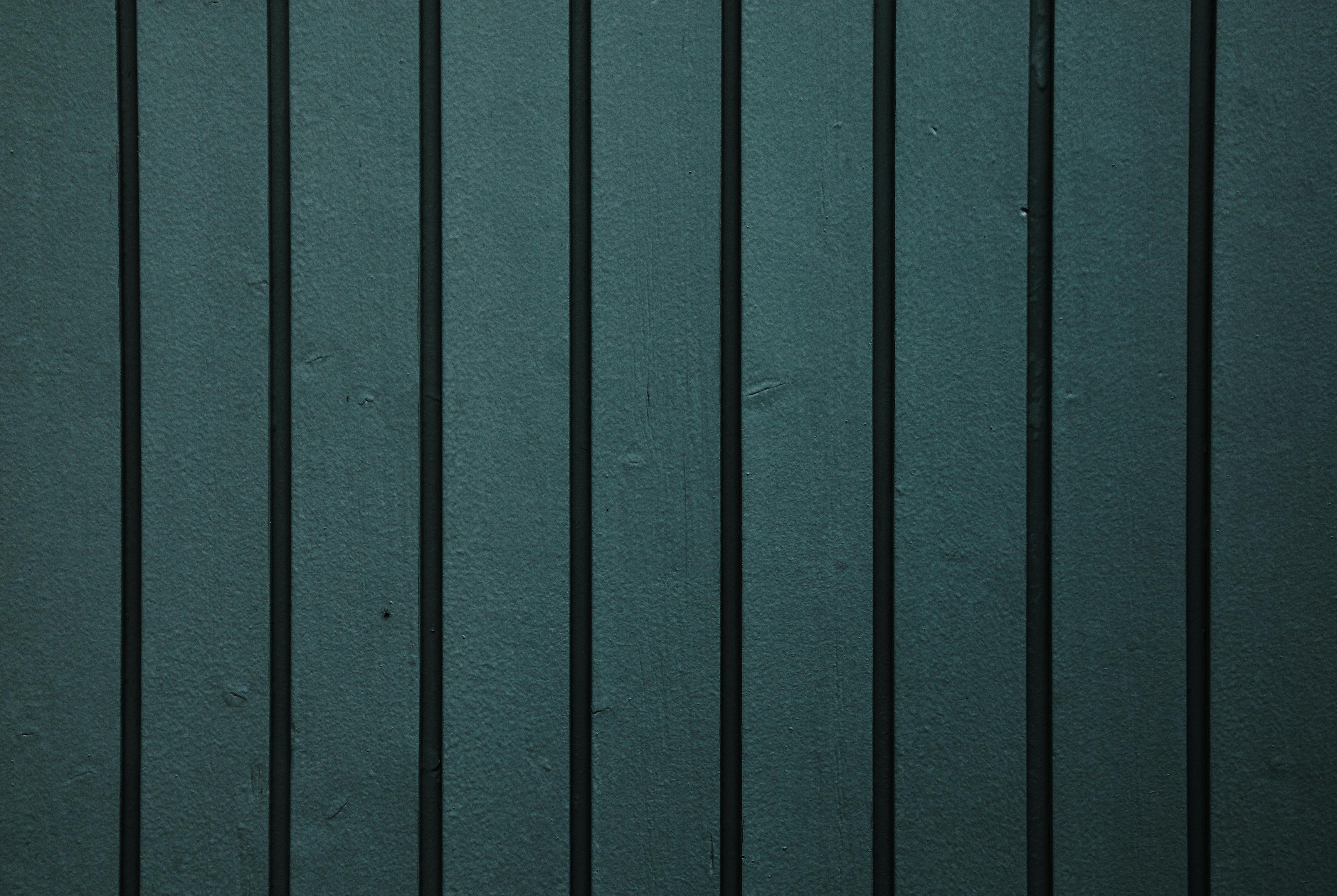 Close-up of a dark wood textured fence, perfect for backgrounds or design.