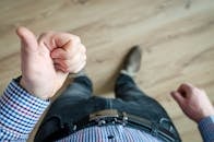 Person Showing His Left Thumb