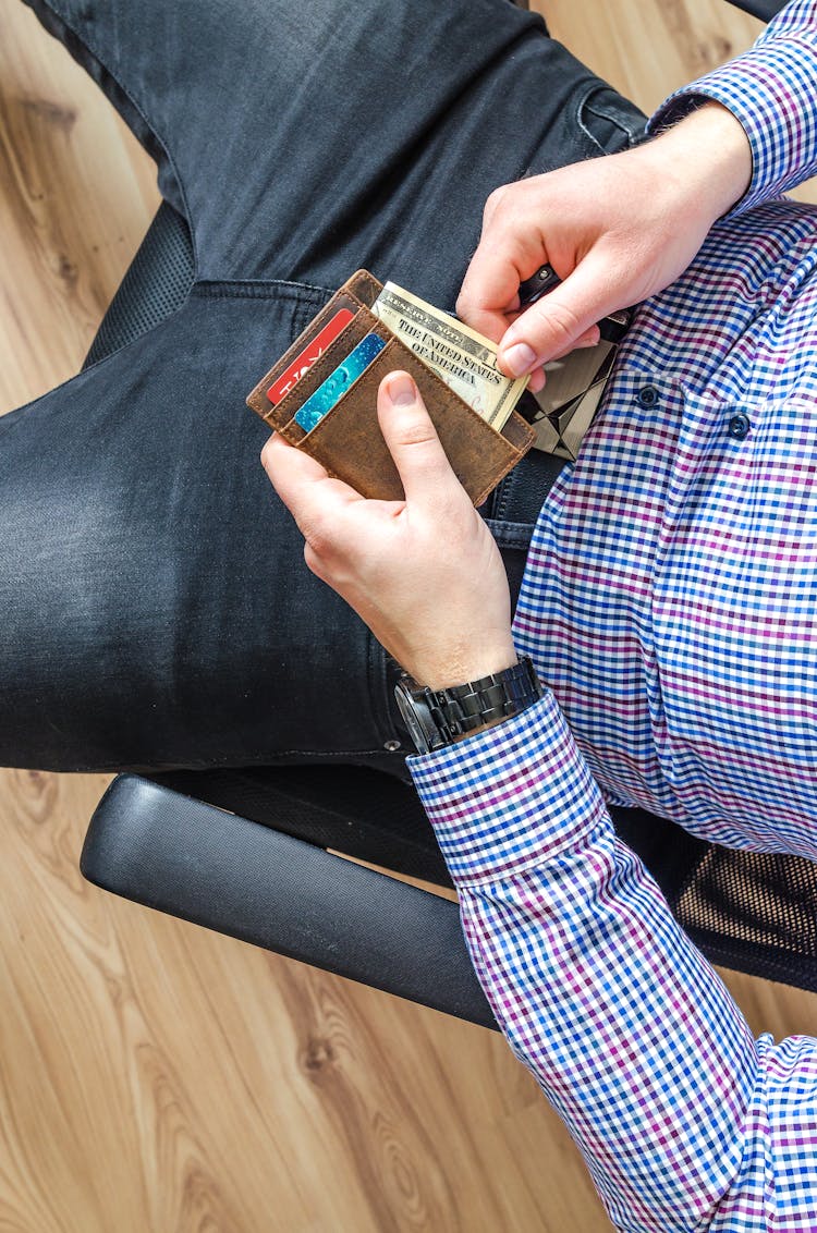 Man Holding Wallet