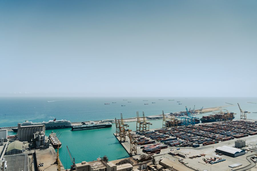Aerial view of a busy corridor terminal with docked ships