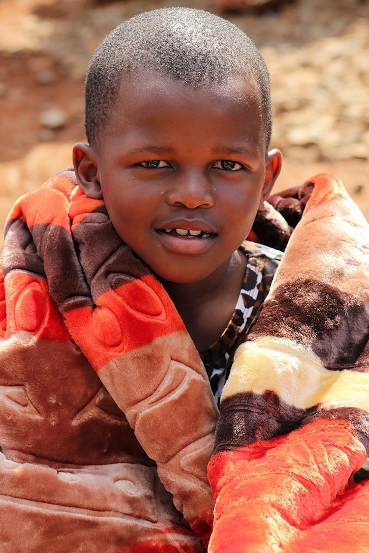 Boy Covered With A Blanket