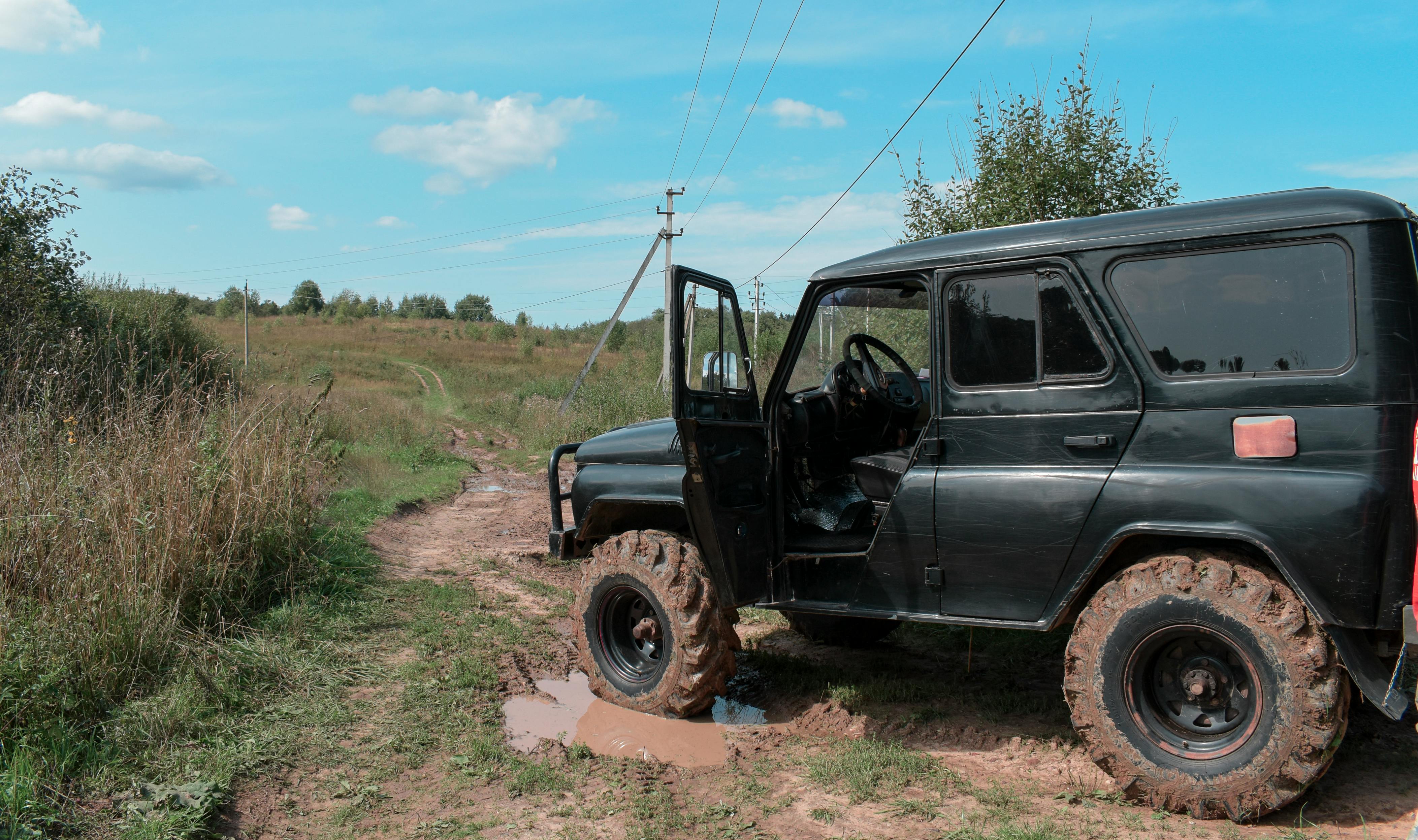 black suv on the dirt road