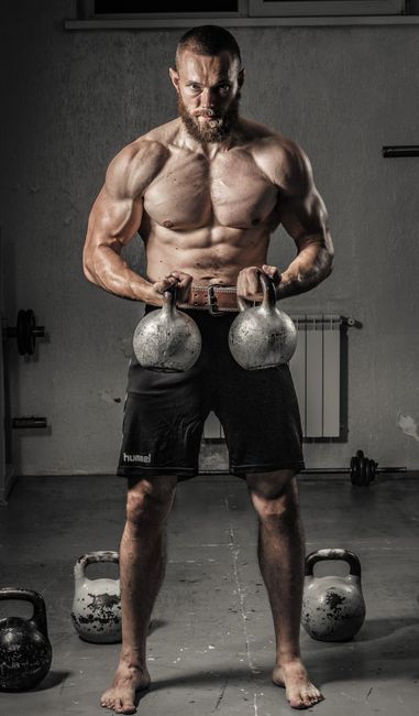 Testosterone hormone health concept with a man holding a beaker