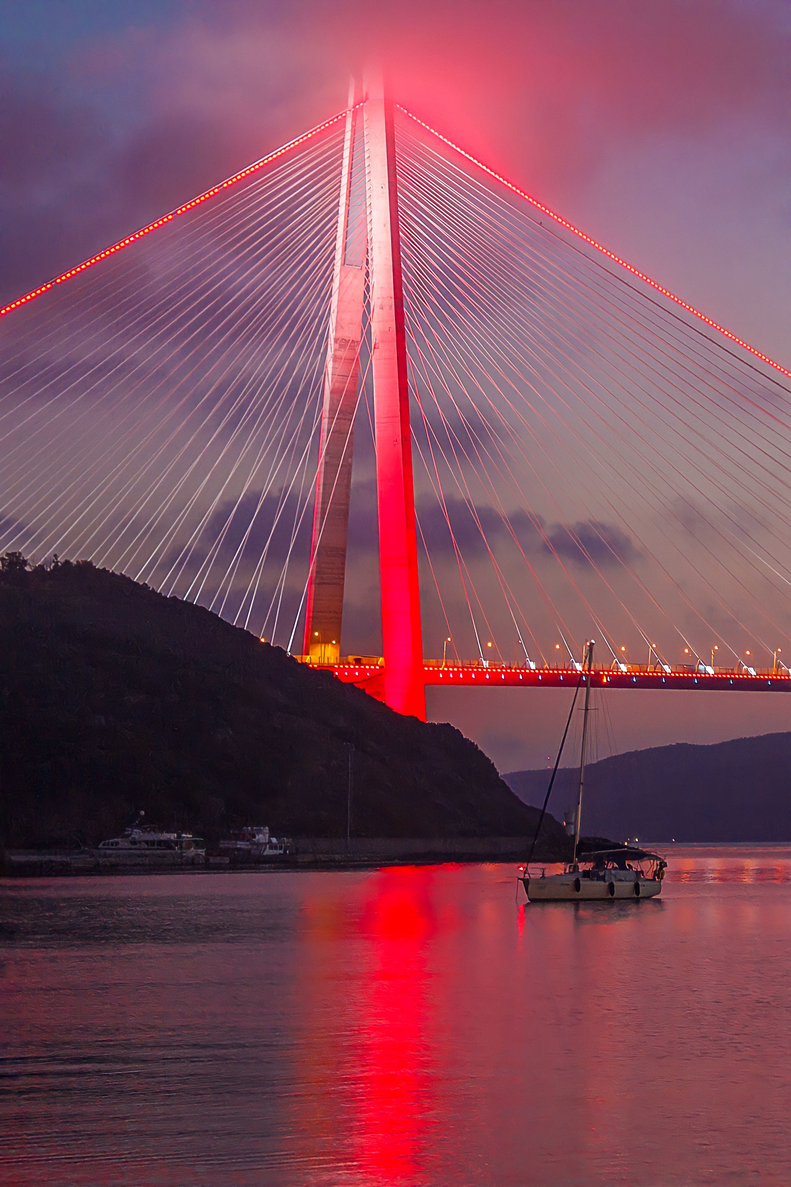 Stunning view of Yavuz Sultan Selim Bridge illuminated at dusk in Istanbul, Turkey