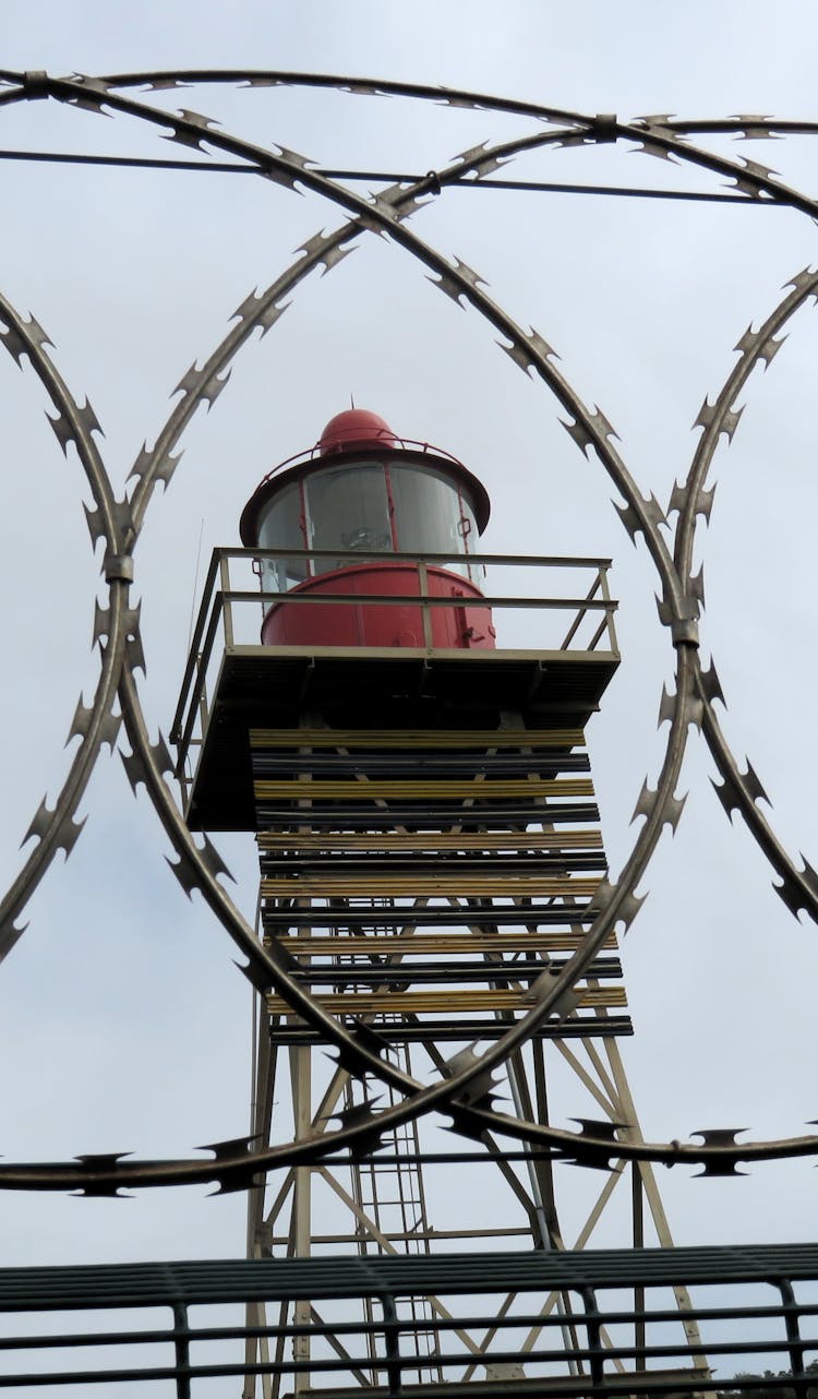 A Watchtower Behind A Fence