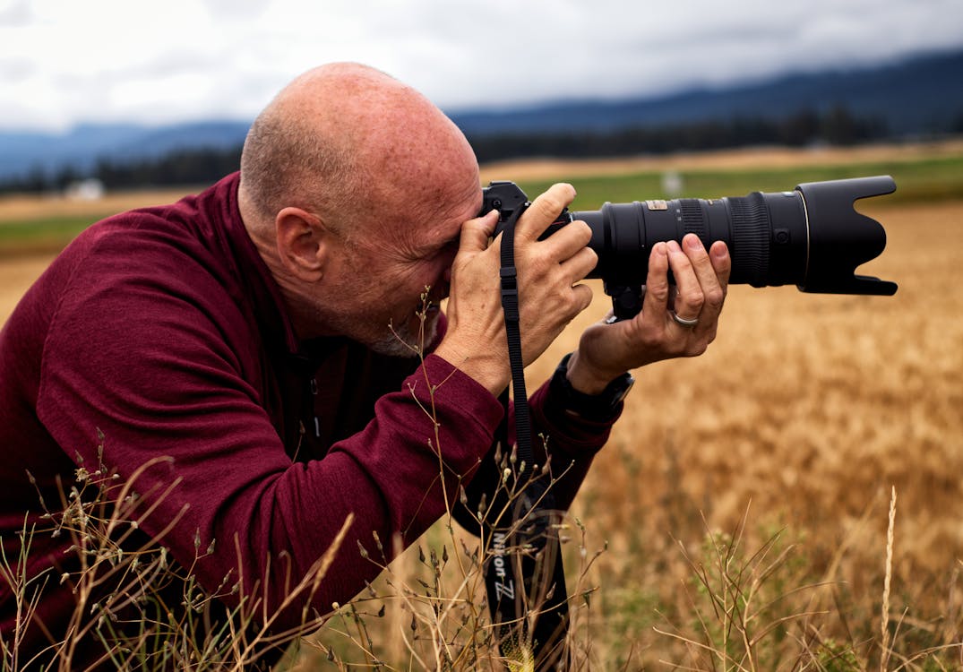 Free A Photographer Taking a Picture Stock Photo