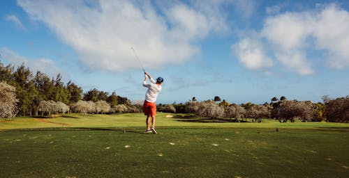 Man in White T Shirt Playing Golf