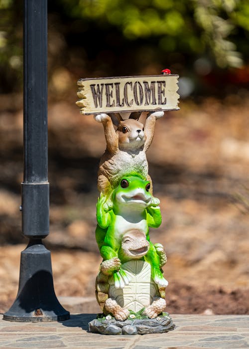 Animal Figurines Holding a Welcome Sign