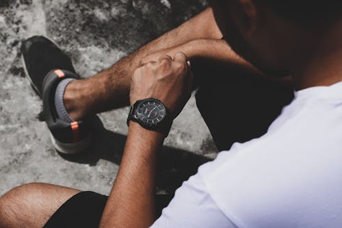 A Man Wearing Tissot Wristwatch