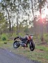 A Motorcycle Parked by the Roadside