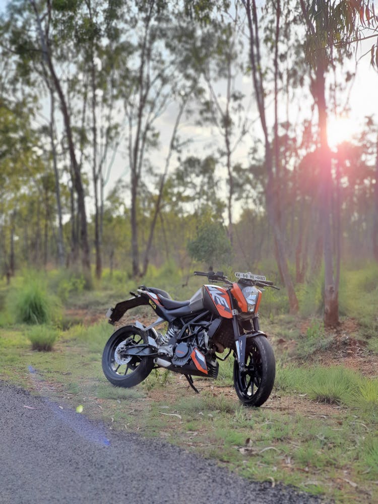 A Motorcycle Parked By The Roadside