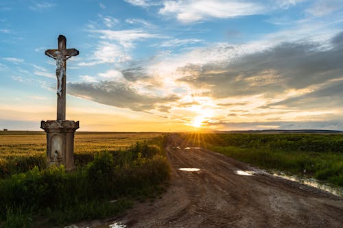 A Crucifix by an Unpaved Road