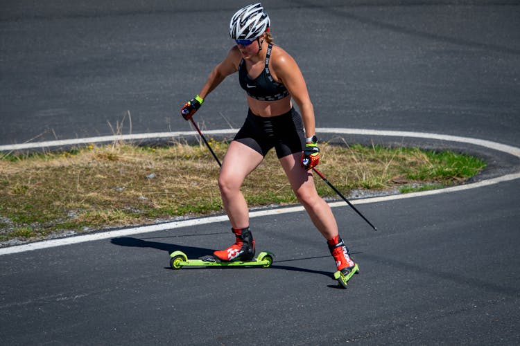 A Fit Woman Roller Skiing
