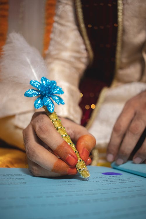 Hand with Painted Fingers Writing