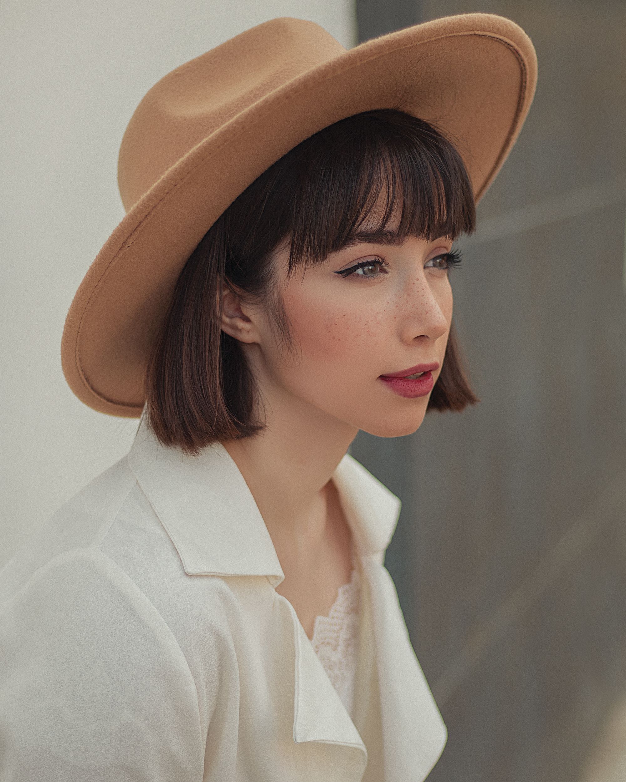 A Woman Wearing a Brown Hat · Free Stock Photo