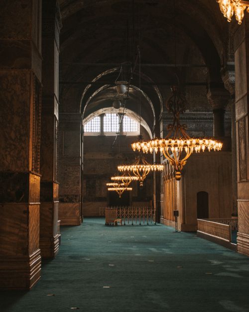 Free Explore the majestic interior of Hagia Sophia Grand Mosque with ornate chandeliers and architectural grandeur. Stock Photo