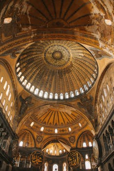 Explore the intricate architectural beauty of Hagia Sophia's dome with Islamic motifs.