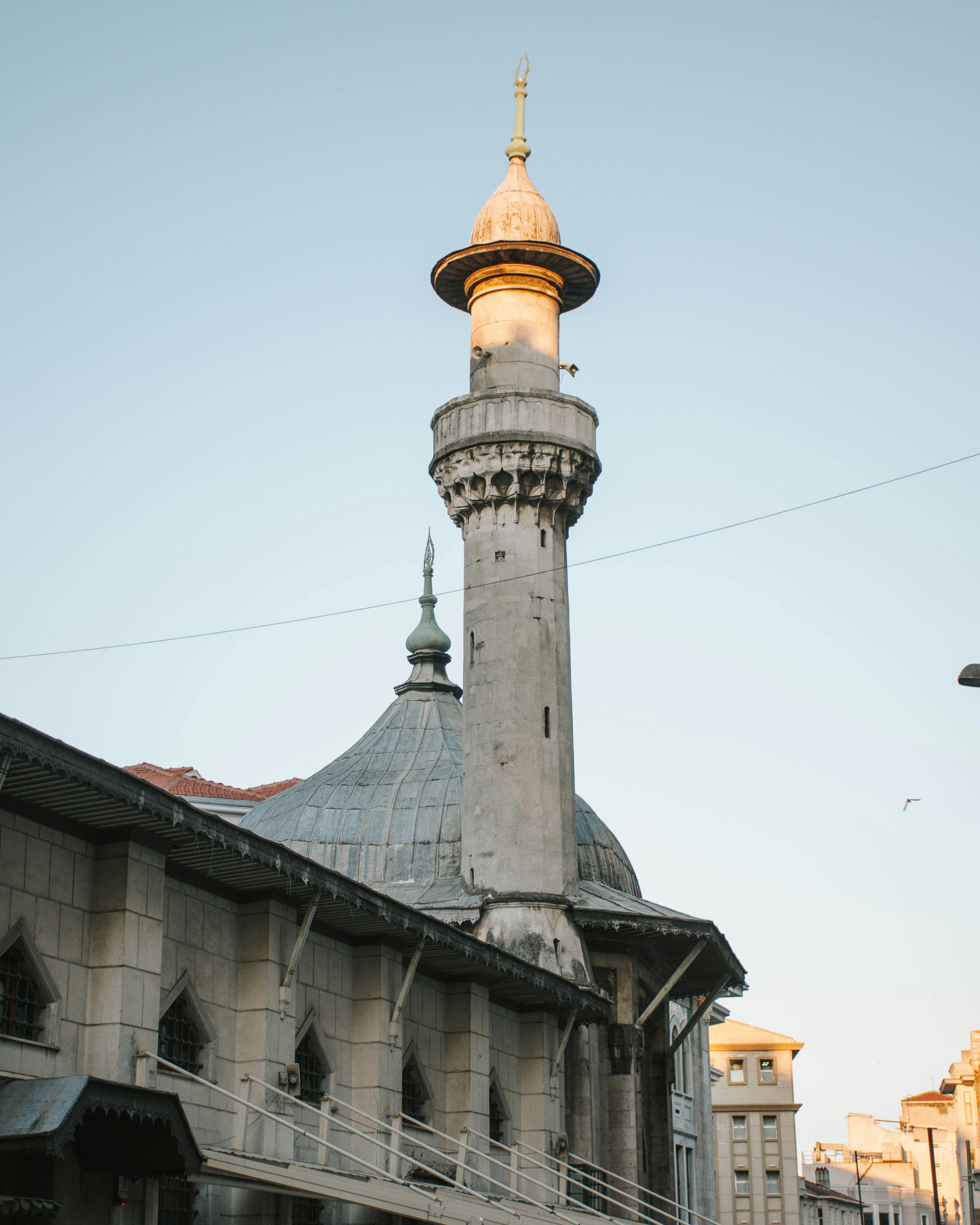 Beautiful capture of historic mosque showcasing Islamic architectural style with intricate minaret details.