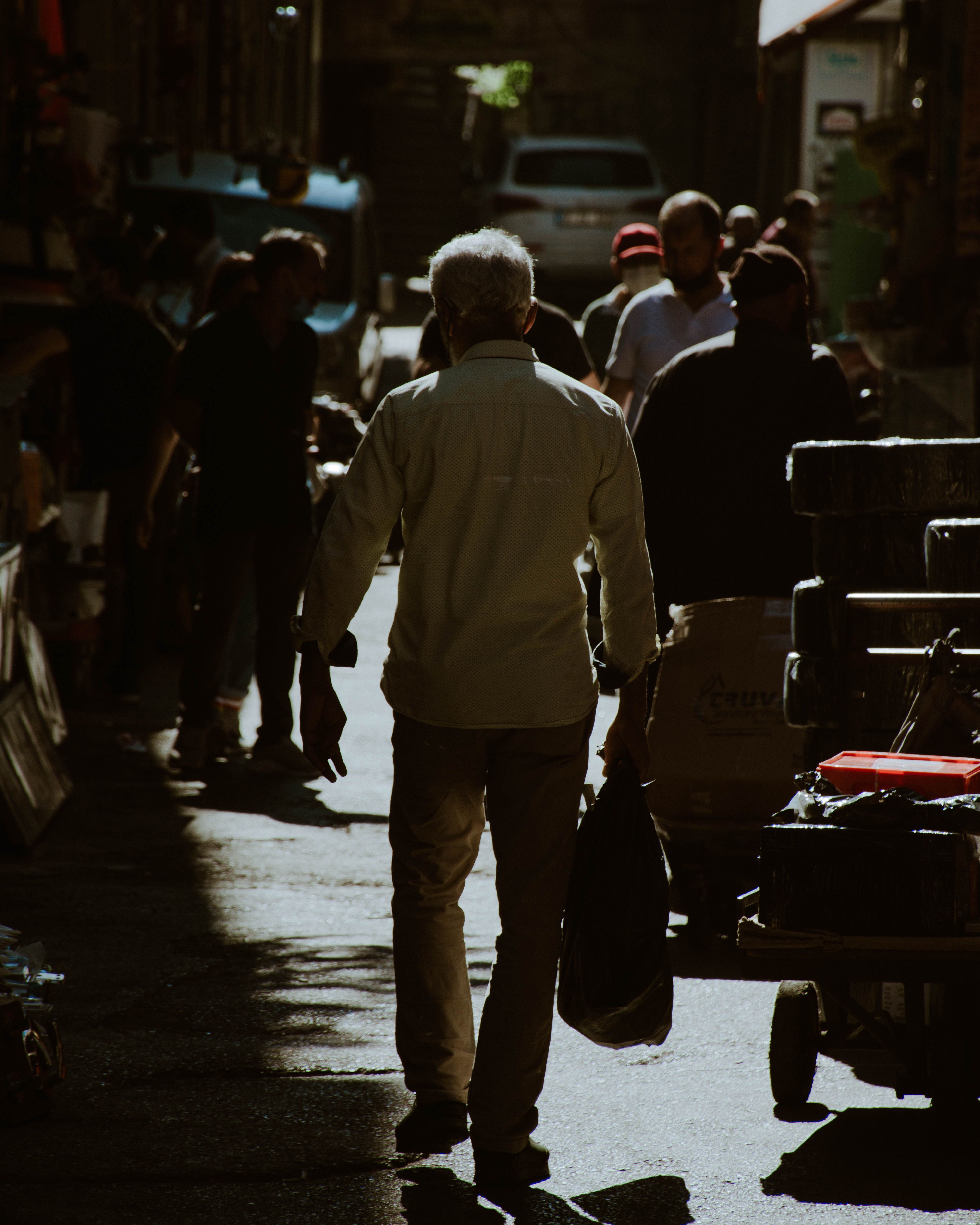 Back View of a Man Walking on a Street · Free Stock Photo