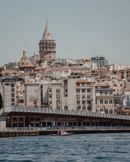Free Capture of Galata Tower dominating the Istanbul skyline over the bustling waterfront. Stock Photo