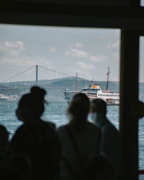 People Enjoying a Ferry Boat Ride