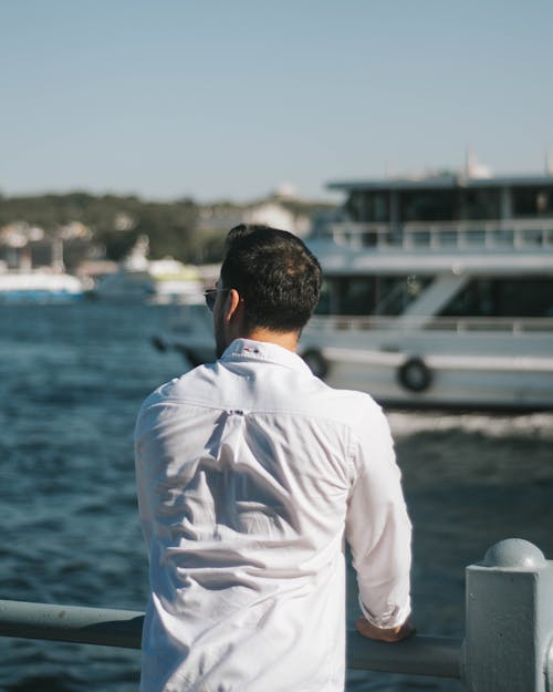 Back Side of a Man Looking Over the Harbor