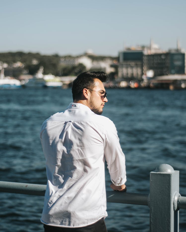 Backside Of A Man Standing In The Bay View Decj