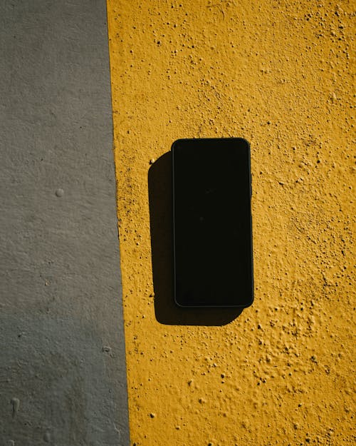 Free Top View of a Black Smartphone Stock Photo