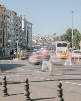 A vibrant urban street with blurred motion capturing the hustle and bustle of city life.