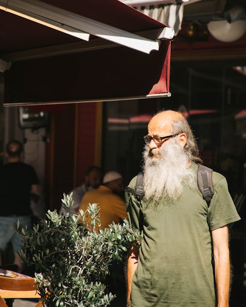 A Bearded Elderly Man in Green Crew Neck T-shirt 