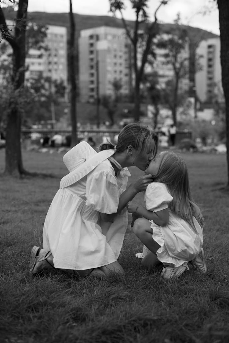 Mother Kissing Her Daughter