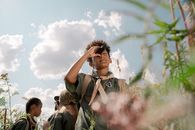 A Boy Using a Spotting Scope