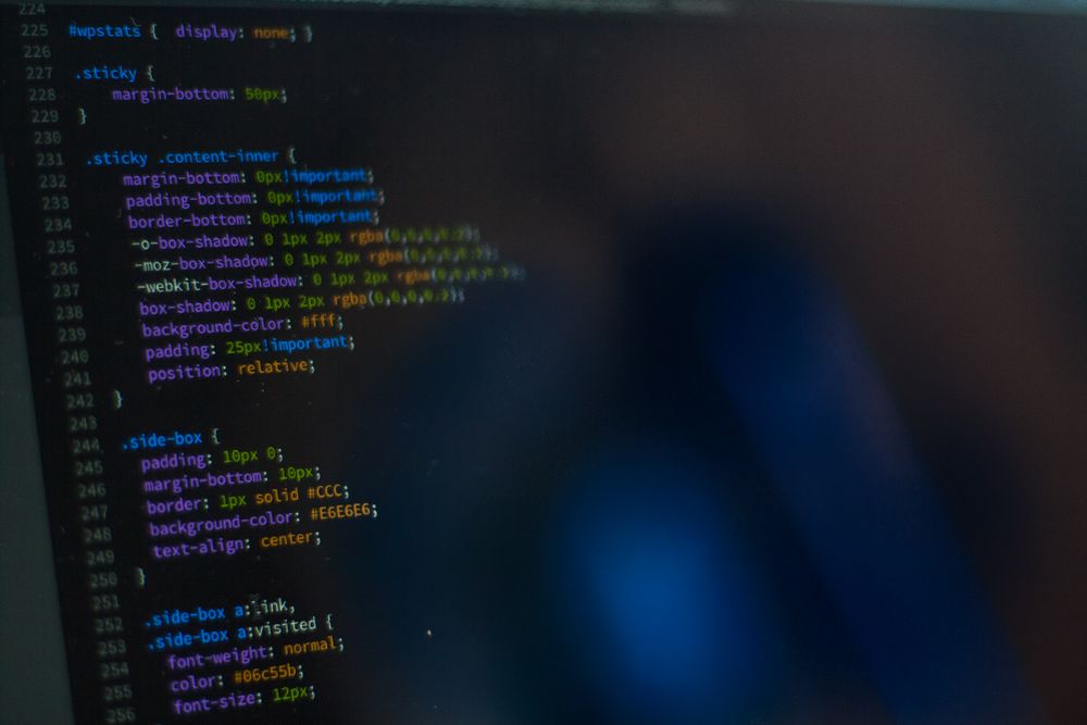 Website code displayed on a monitor