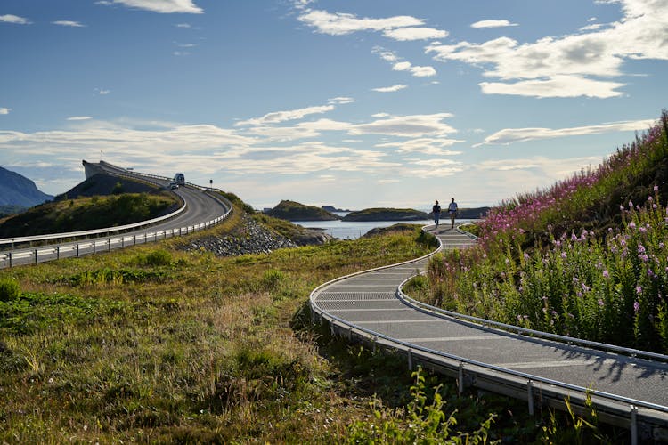 Trail By Highway Leading Towards Lake