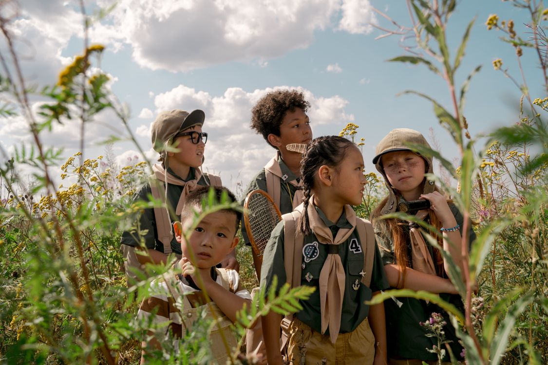 Scouts Looking Around in a Field · Free Stock Photo