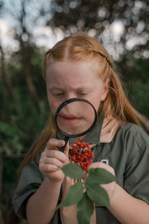 A Girl Using Magnifying Glass
