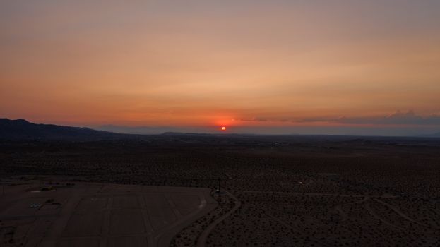 Captivating desert sunset with vibrant colors and expansive horizon.