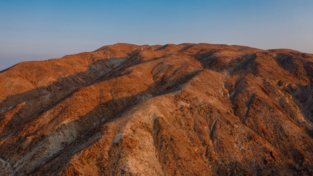 Brown Mountain Under Blue Sky