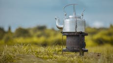 Teapot on Fire in Meadow