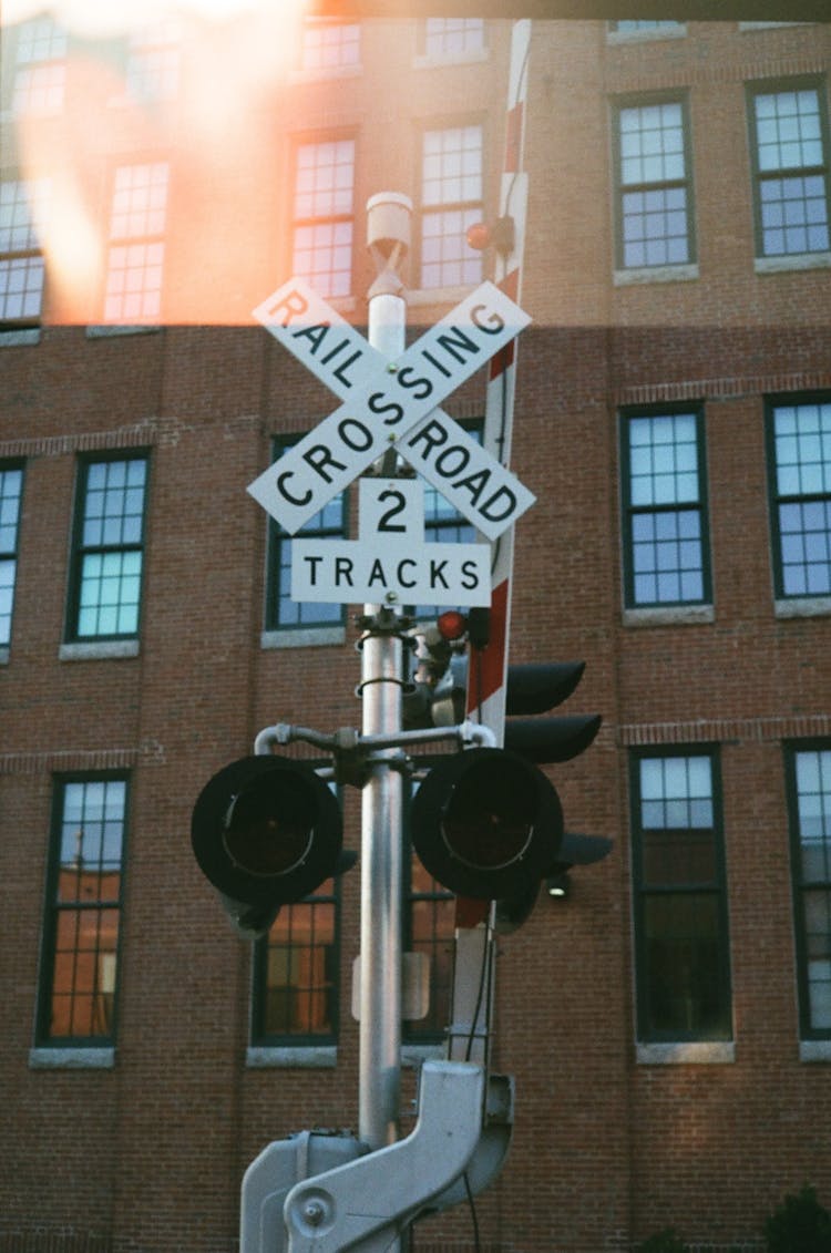 White And Black Rail Road Crossing Sign