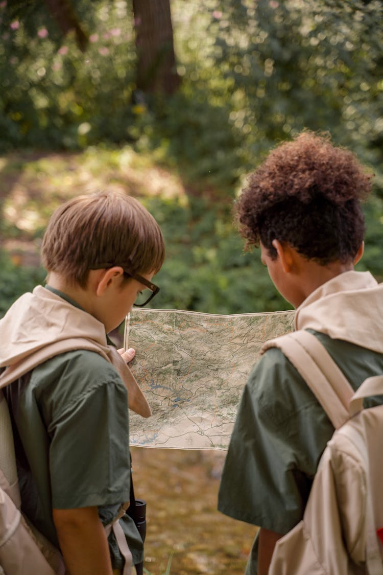 Two Boys Looking A Map