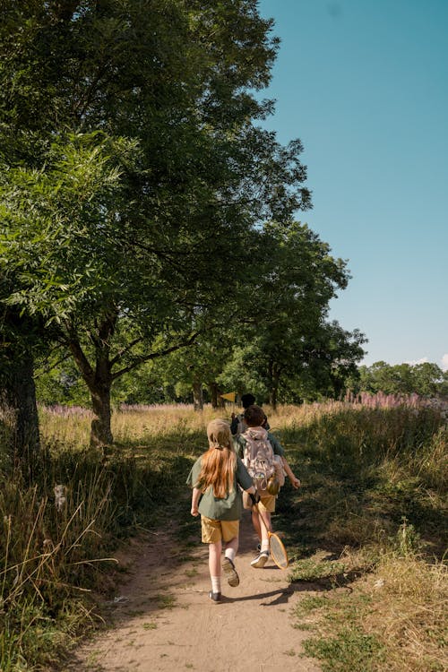 Free Group of Children Walking on a Pathway Stock Photo
