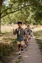 Scouts Hiking in the Forest Trail
