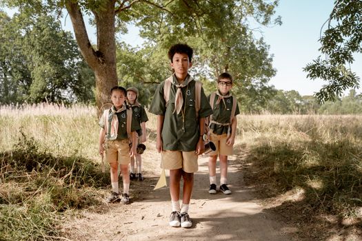 Scouts Standing at an Unpaved Path