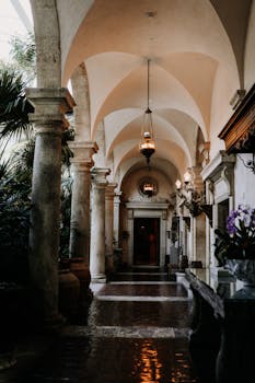 Explore the neoclassical colonnades of Vizcaya Museum in Miami with elegant arches and classic architectural details.