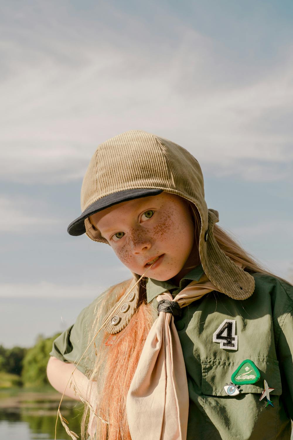 A Beautiful Girl Biting a Rice Grass · Free Stock Photo